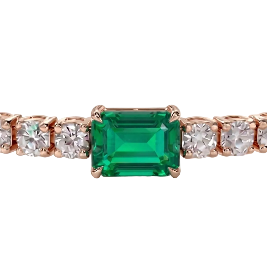 alt="close up view of lab grown emerald cut columbian emerald and round diamond east-west tennis bracelet in 14k rose gold"