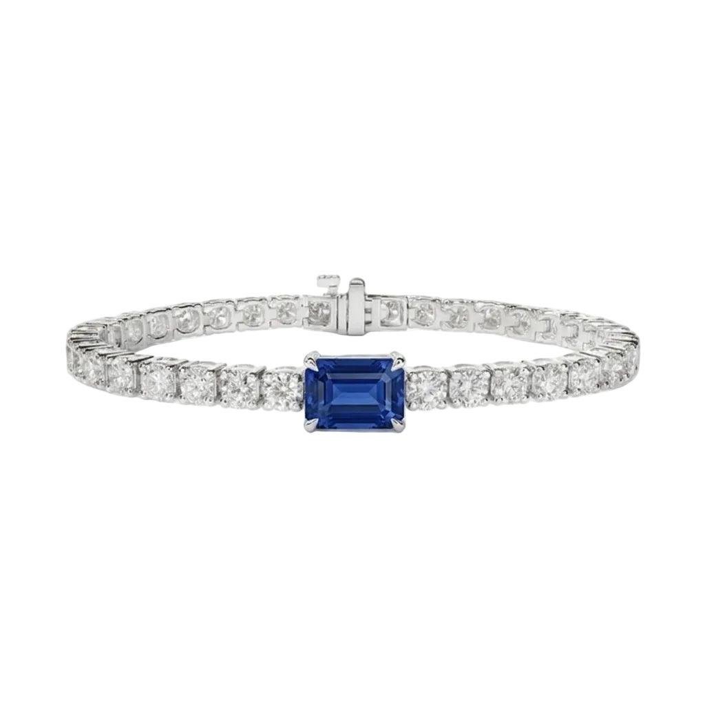 alt="front view of lab grown emerald cut blue sapphire and round diamond east-west tennis bracelet in 14k white gold"