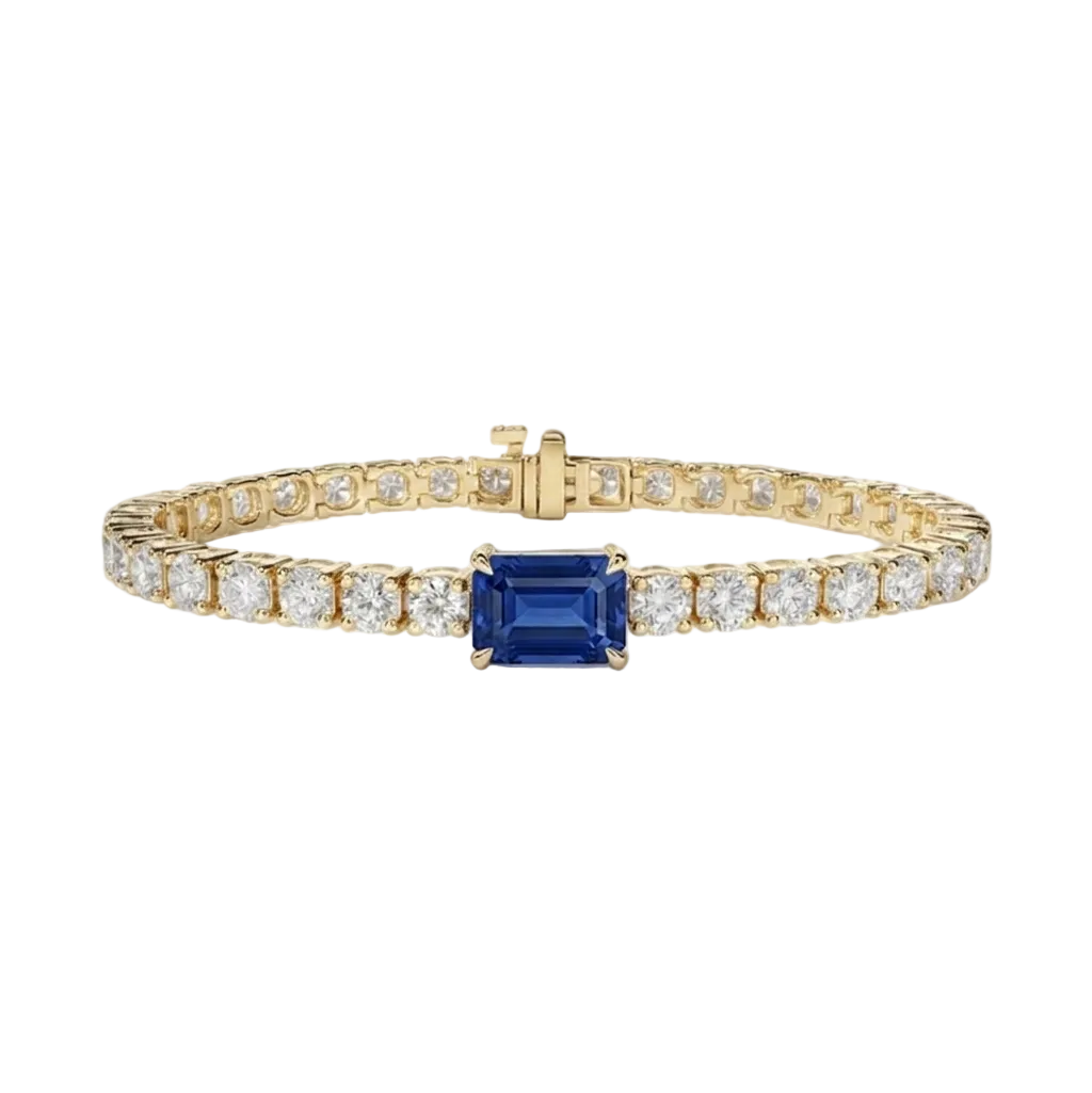 alt="front view of lab grown emerald cut blue sapphire and round diamond east-west tennis bracelet in 14k yellow gold"