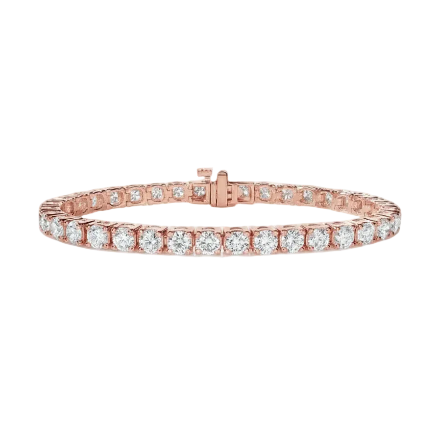 alt="front view of classic four prong round lab grown diamond tennis bracelet in 14K rose gold"