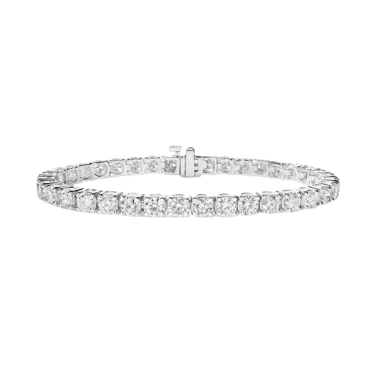 alt="front view of classic four prong round lab grown diamond tennis bracelet in 14K white gold"