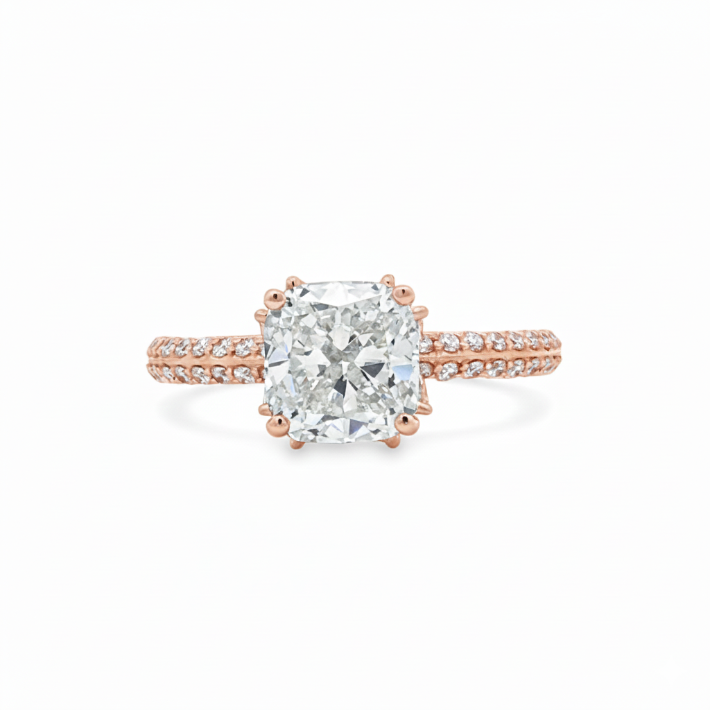 alt="front view of lab grown cushion cut diamond engagement ring with marquise hidden halo and accented band in 14K rose gold"
