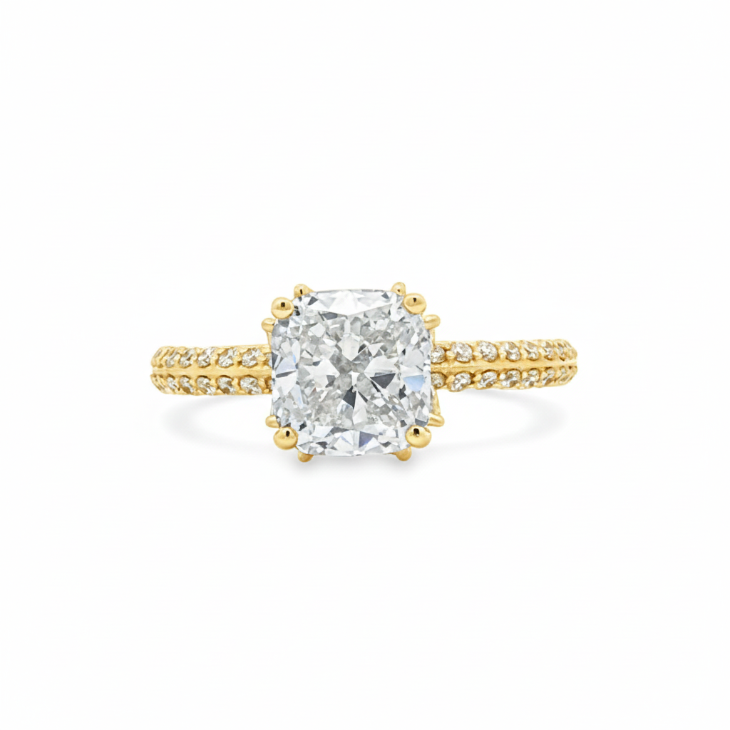 alt="front view of lab grown cushion cut diamond engagement ring with marquise hidden halo and accented band in 14K yellow gold"