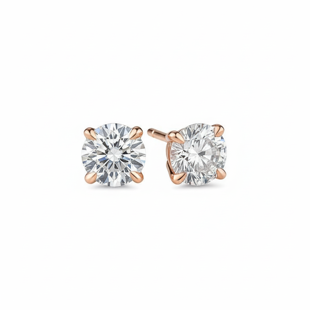 alt="front view of lab grown round cut diamond four prong stud earring in 14K rose gold"
