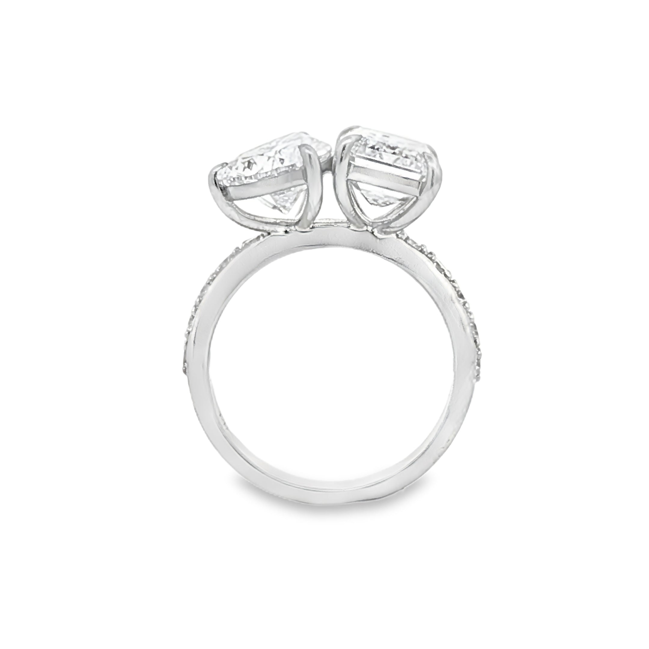 alt="profile view of lab grown pear and emerald cut diamond toi et moi ring in 14K white gold"