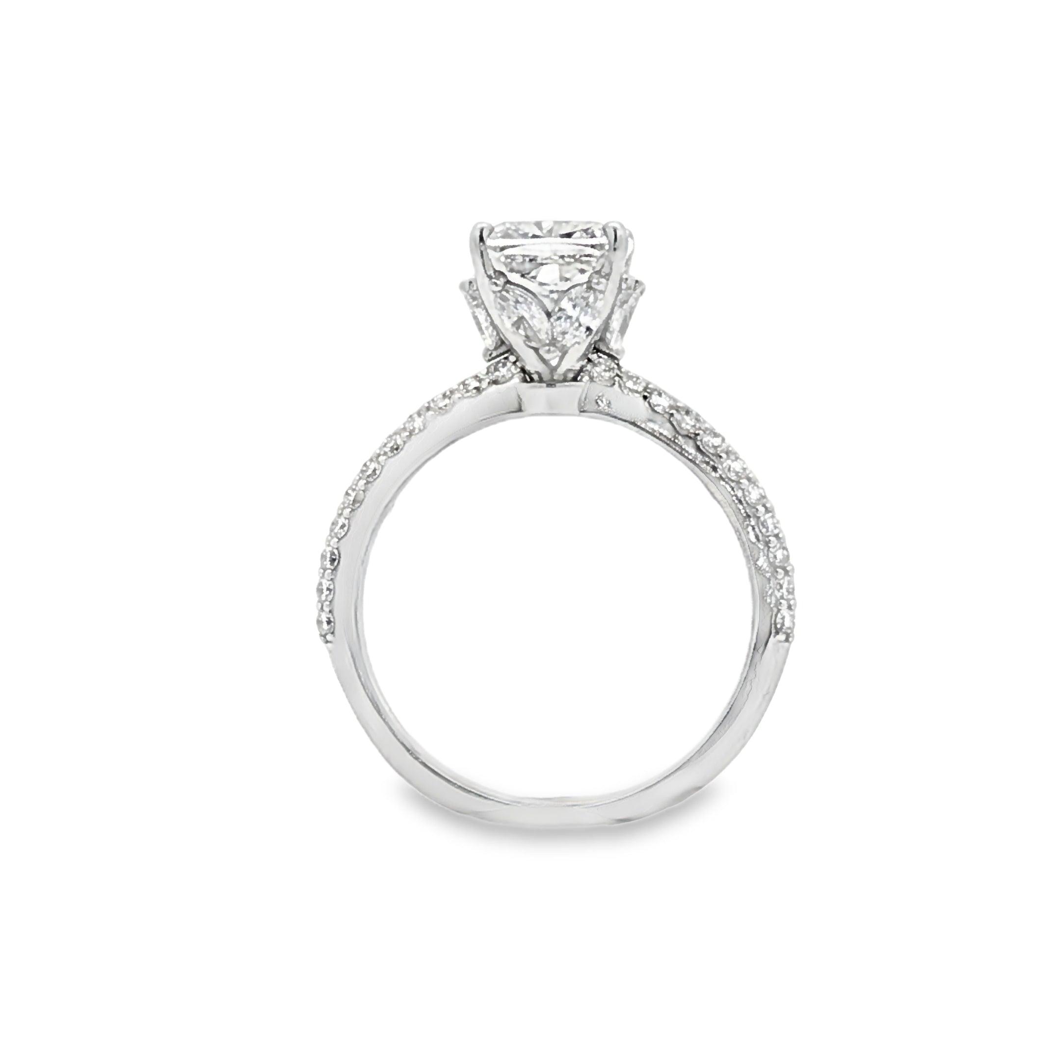 alt="profile view of lab grown cushion cut diamond engagement ring with marquise hidden halo and accented band in 14K white gold"