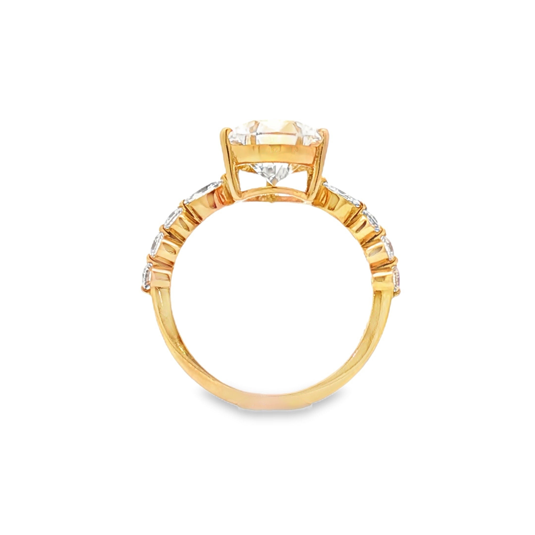 alt="profile view of lab grown pear cut diamond engagement ring with accent band in 14K yellow gold"