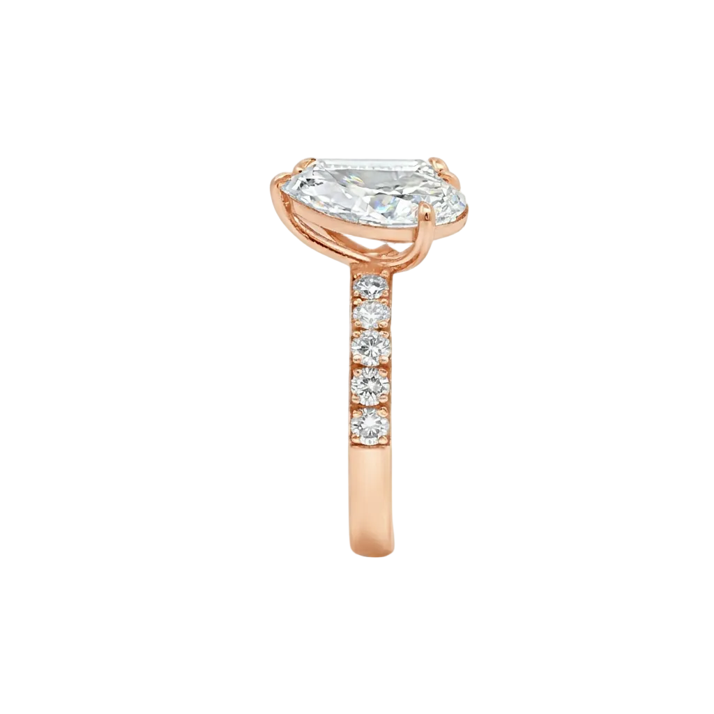 alt="side view lab grown diamond toi et moi ring 14K rose gold"