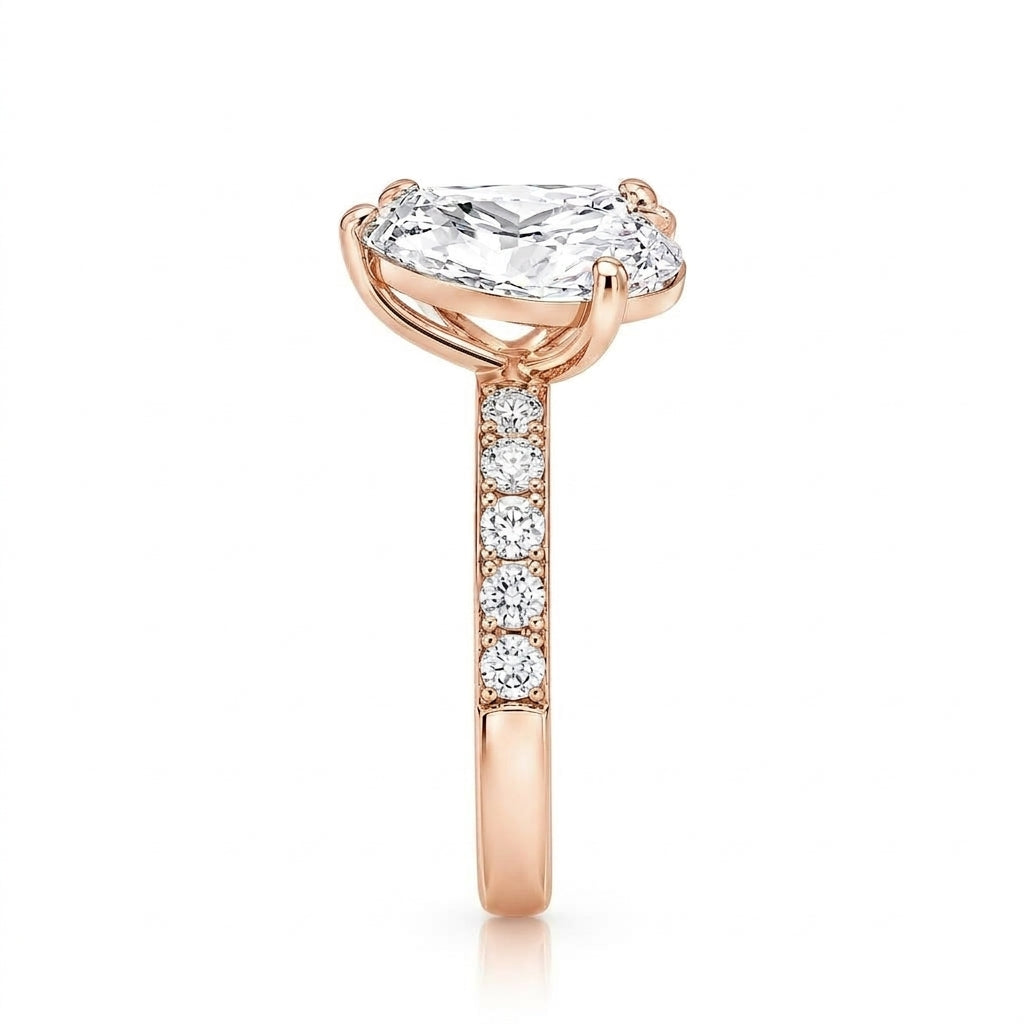 alt="side view lab grown diamond toi et moi ring 14K rose gold"