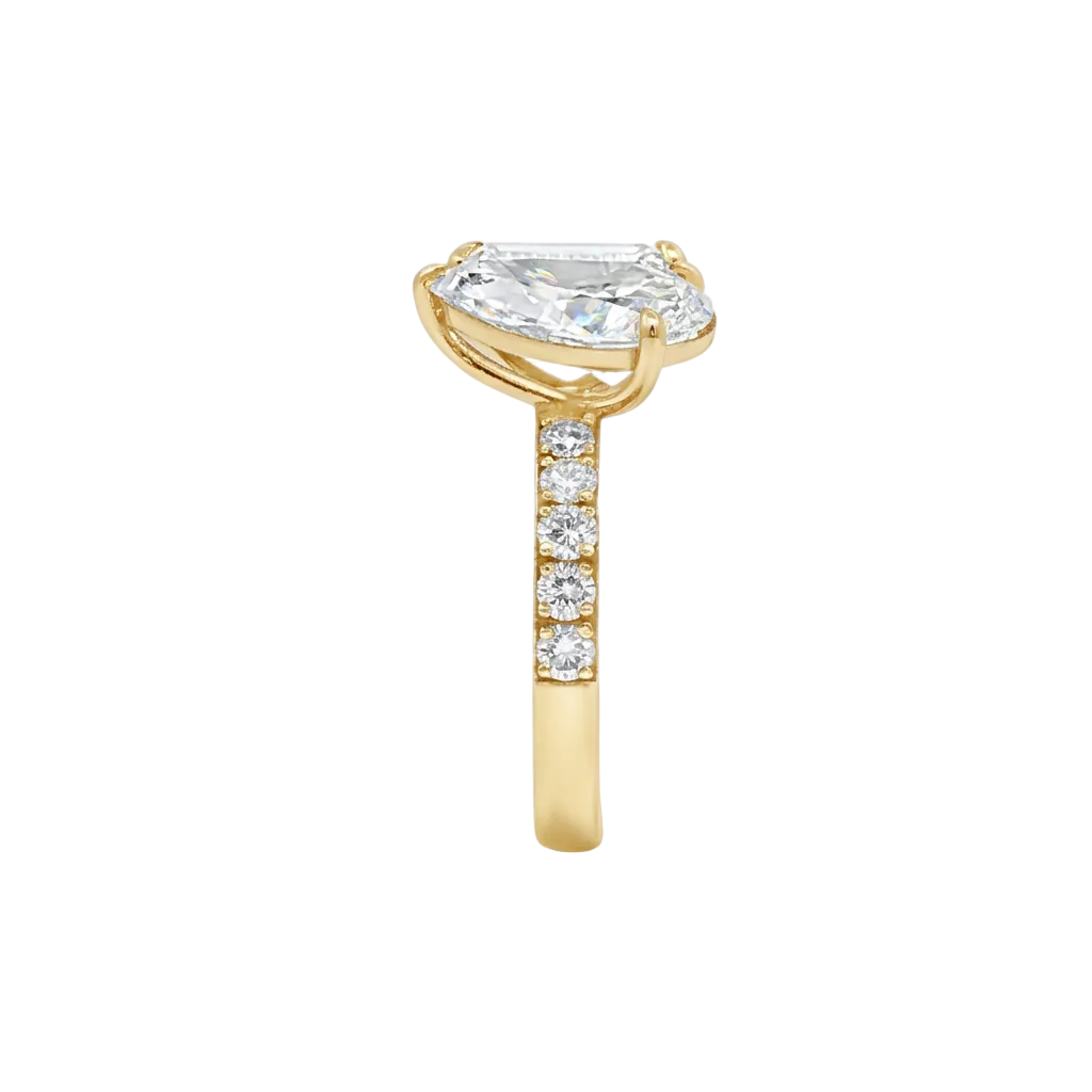 alt="side view lab grown diamond toi et moi ring 14K yellow gold"