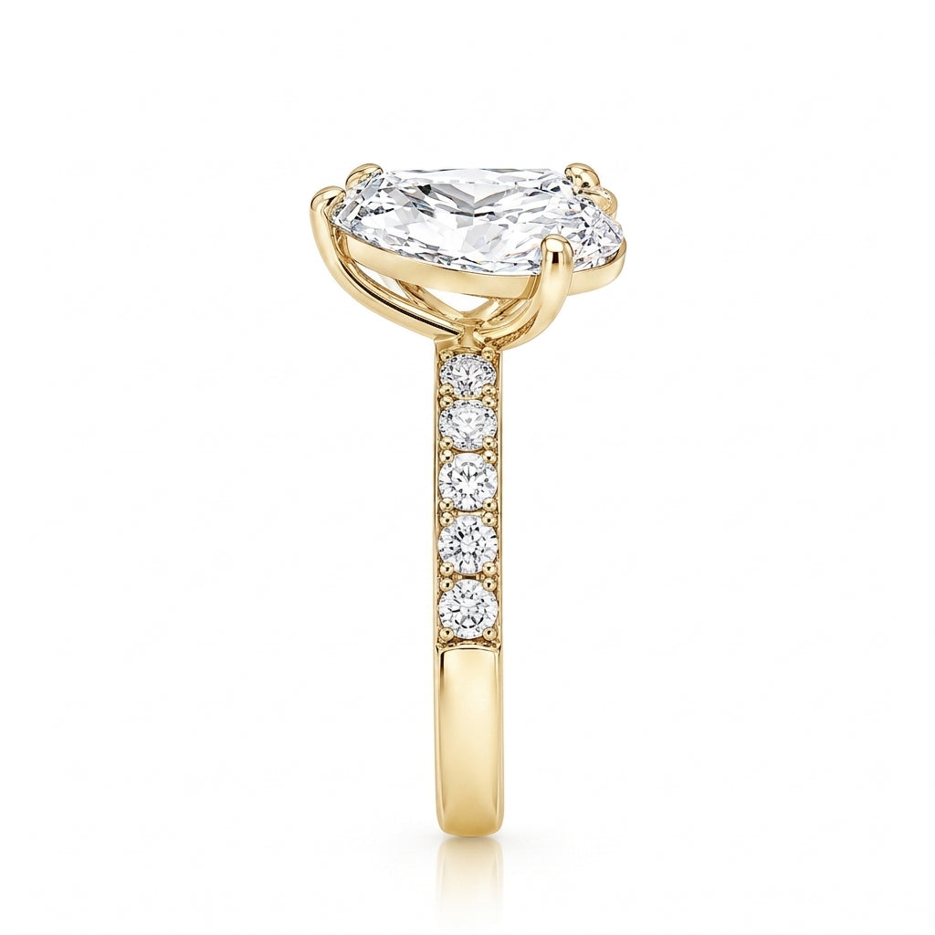 alt="side view lab grown diamond toi et moi ring 14K yellow gold"