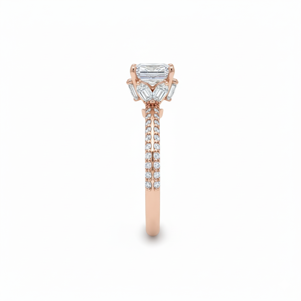 alt="side view of lab grown cushion cut diamond engagement ring with marquise hidden halo and accented band in 14K rose gold"