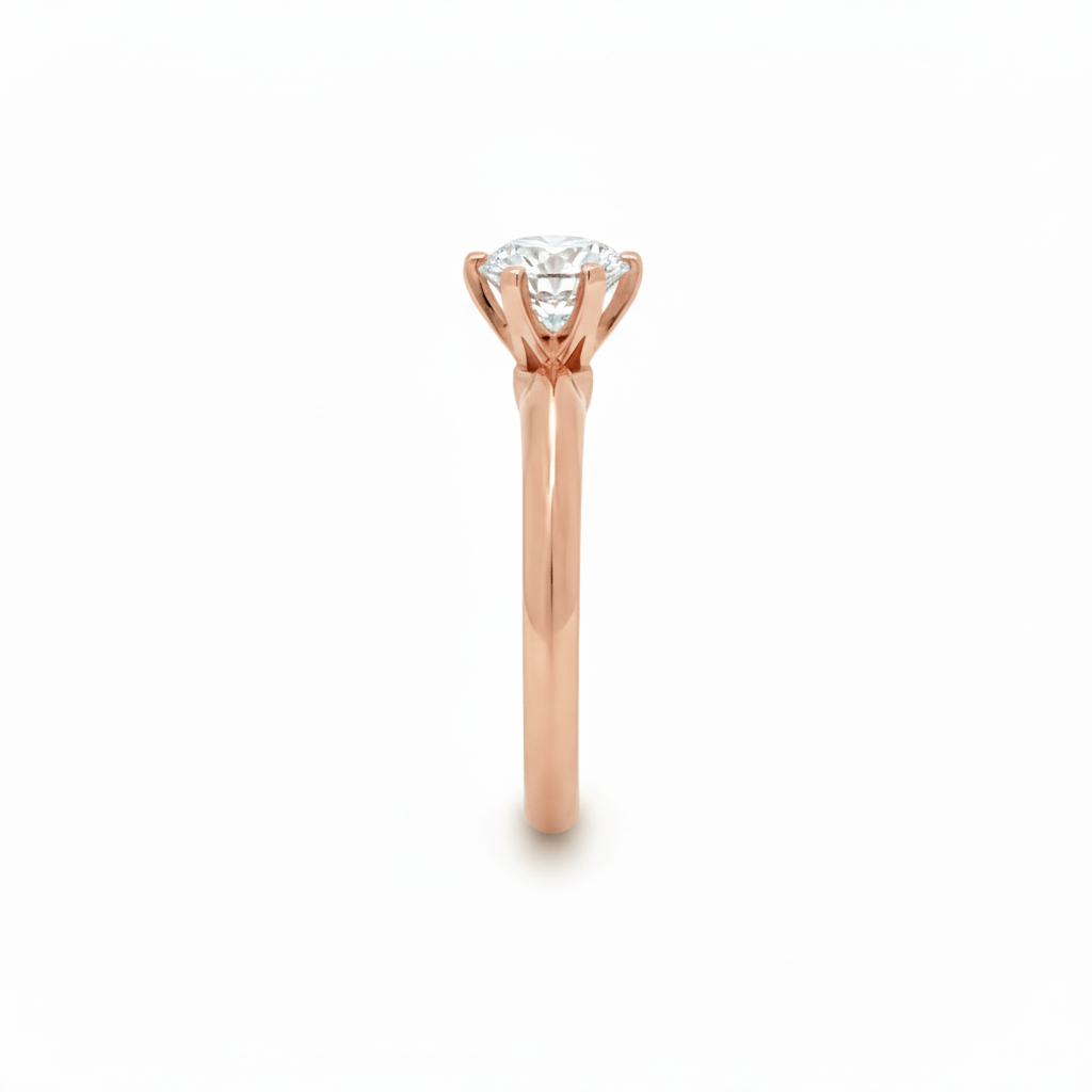 alt="side view of lab grown round cut diamond six prong setting solitaire engagement ring in 14K rose gold"