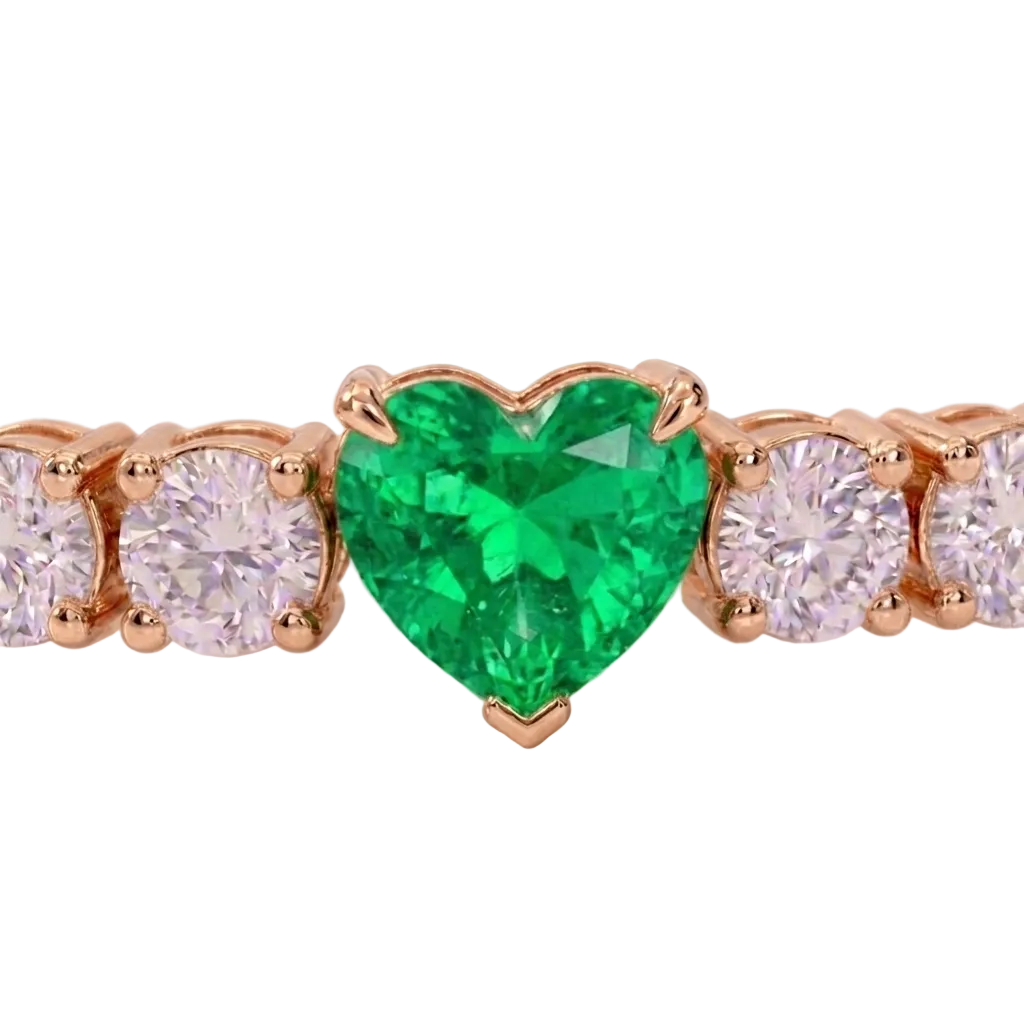 alt="close up view of lab grown heart cut columbian emerald and round diamond east-west tennis bracelet in 14k rose gold"