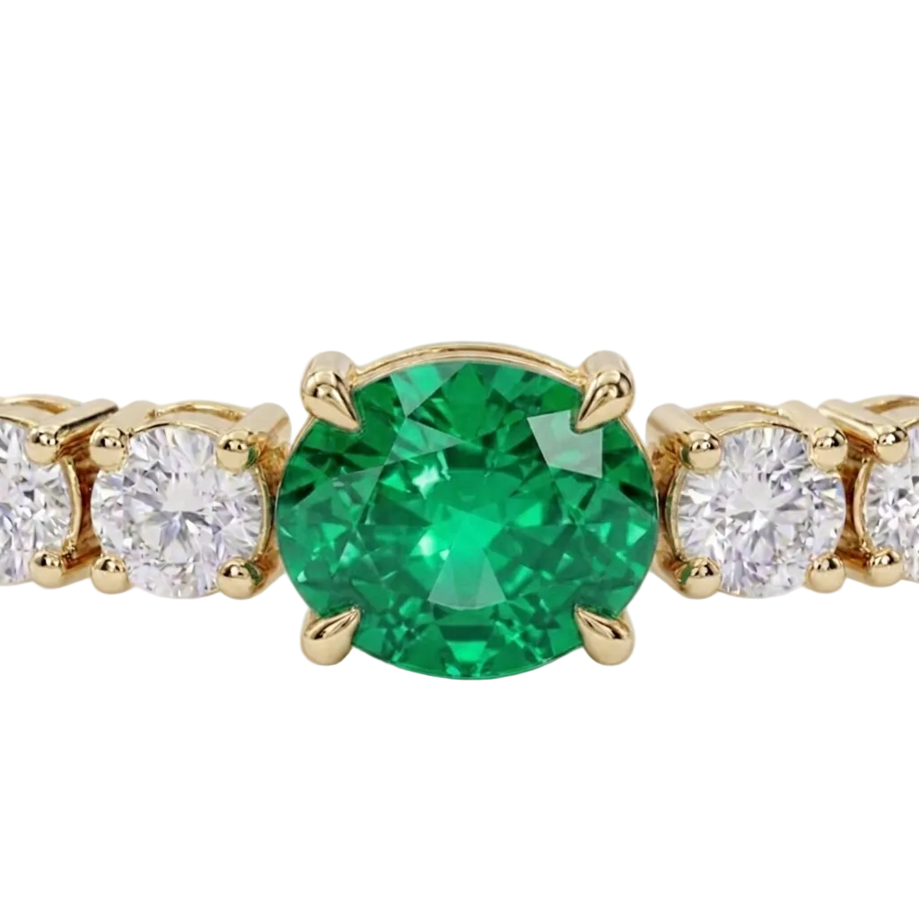 alt="close up view of lab grown oval columbian green emerald and round diamond east-west tennis bracelet in 14k yellow gold"