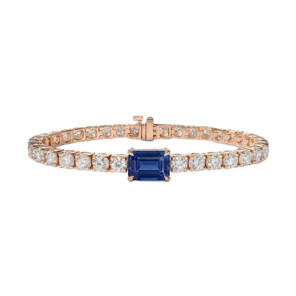 alt="front view of lab grown emerald cut blue sapphire and round diamond east-west tennis bracelet in 14k rose gold"
