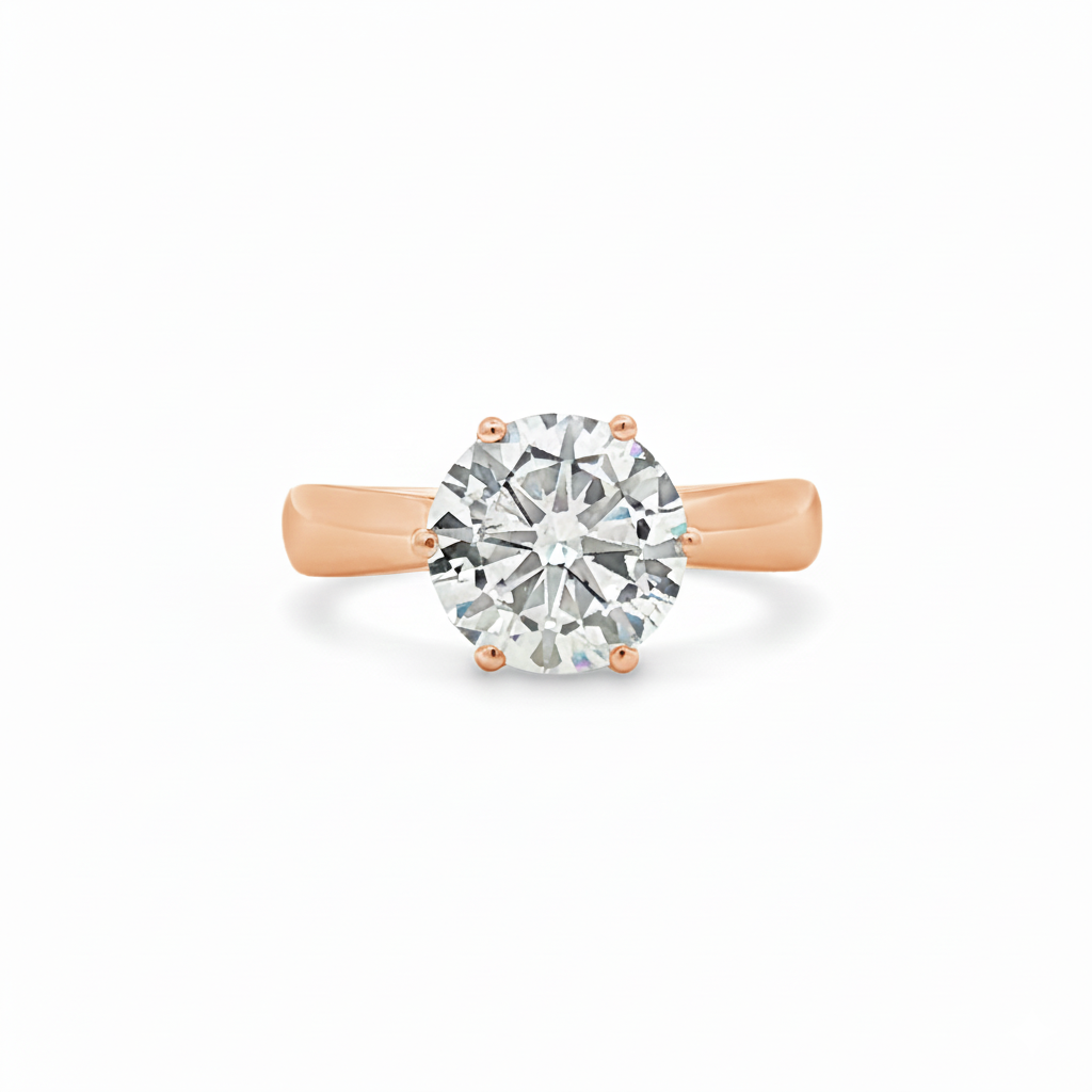 alt="front view of lab grown round cut diamond four prong setting solitaire engagement ring in 14K rose gold"