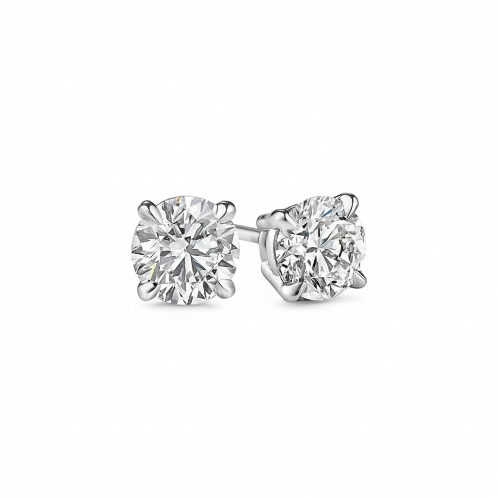 alt="front view of lab grown round cut diamond four prong stud earring in 14K white gold"