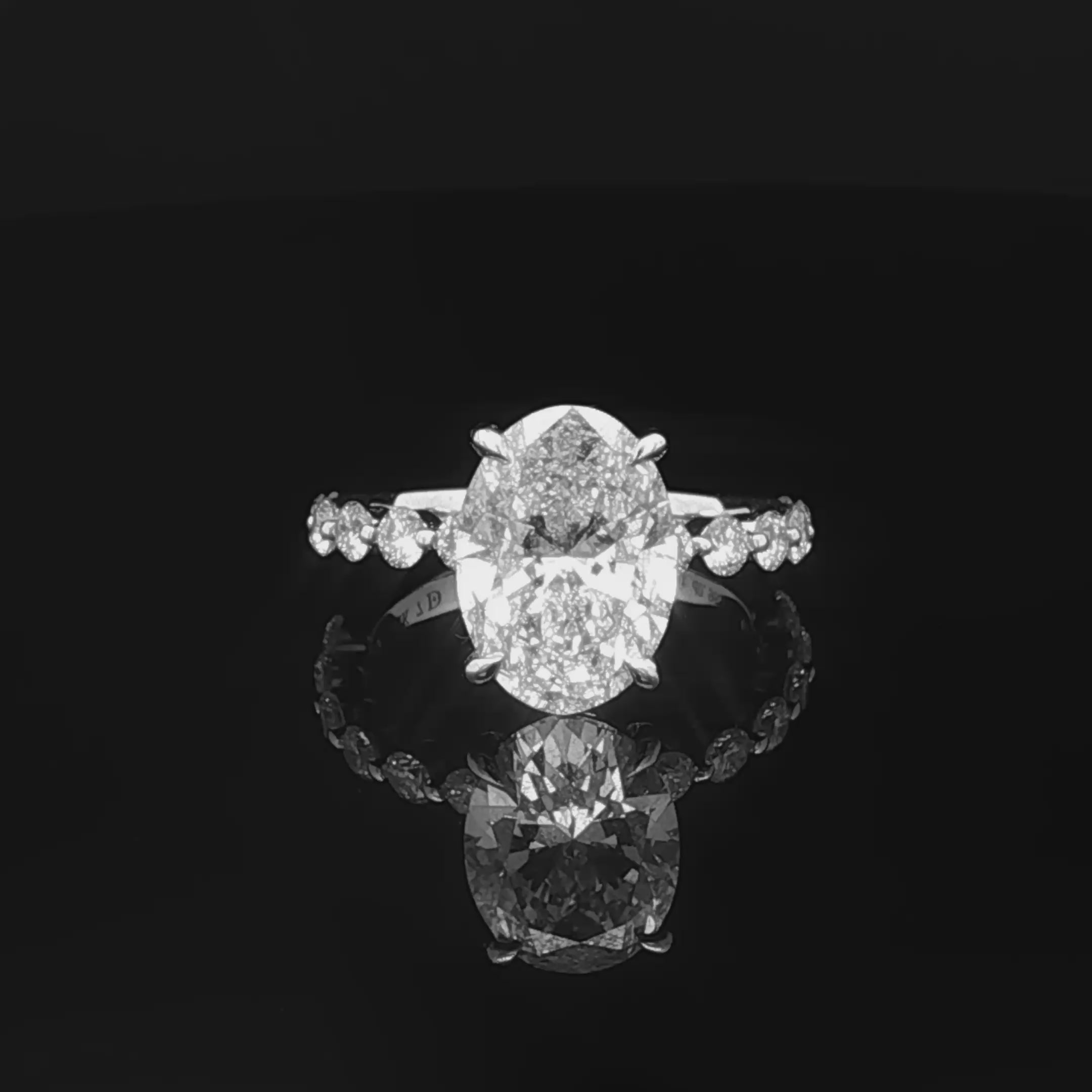 alt="360 video of lab grown oval cut diamond engagement ring with accented band in 14K white gold"