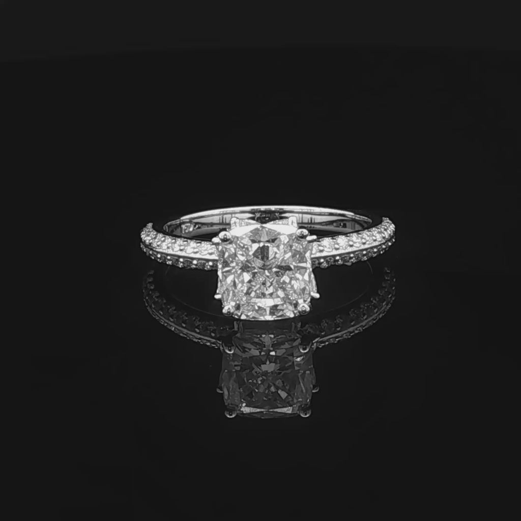 alt="360 video of lab grown cushion cut diamond engagement ring with marquise hidden halo and accented band in 14K yellow gold"