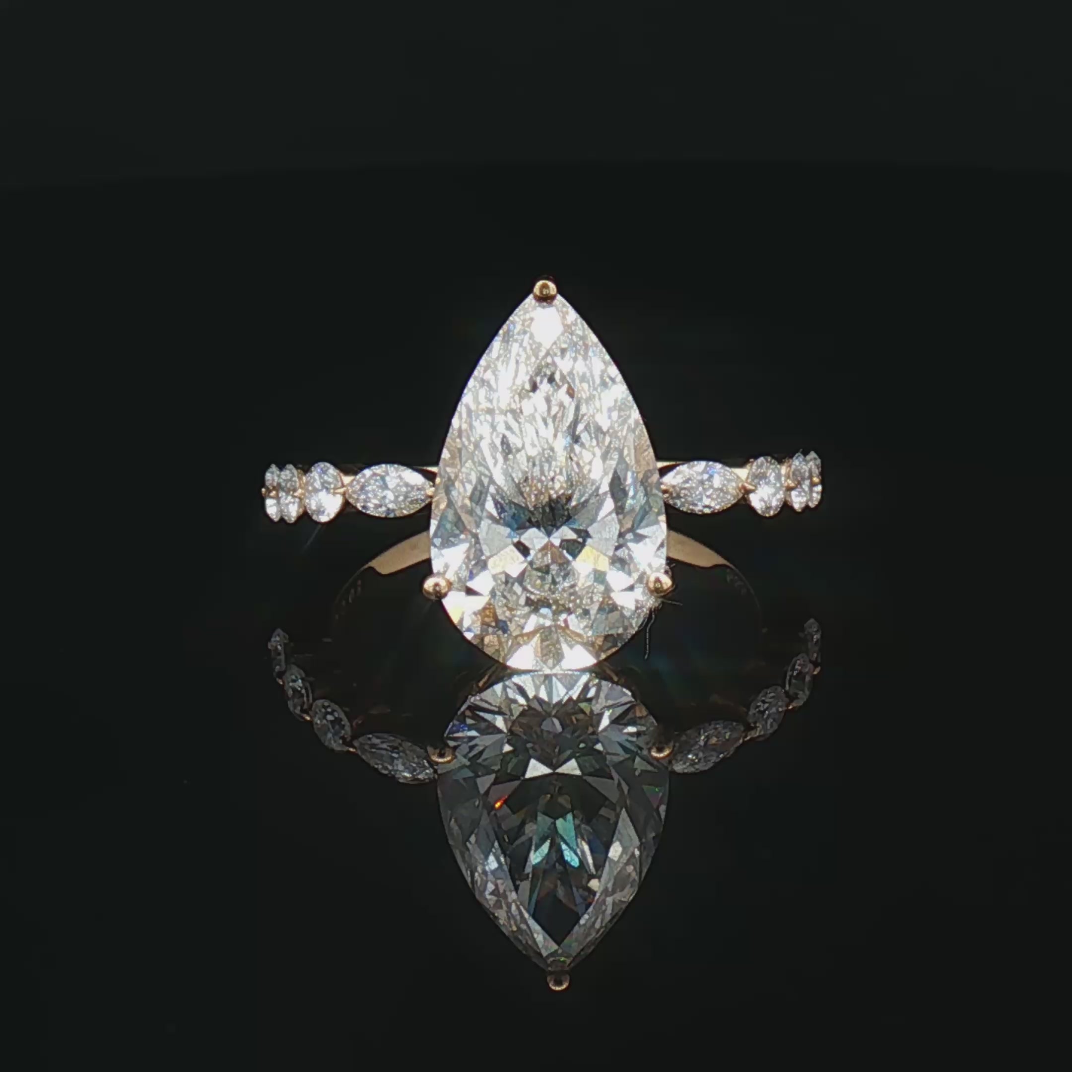 alt="360 video of lab grown pear cut diamond engagement ring with accent band in 14K white gold"