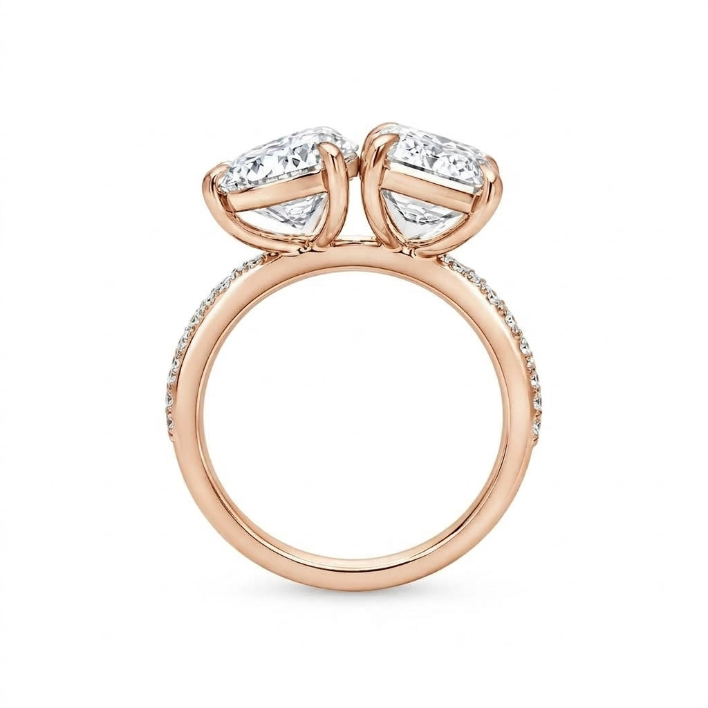 alt="profile view lab grown diamond toi et moi ring 14K rose gold"