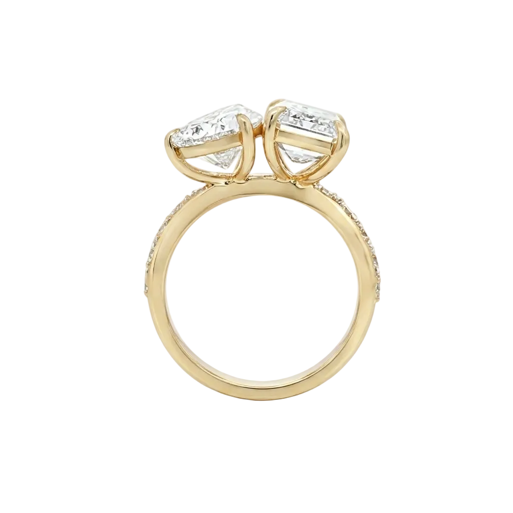 alt="profile view lab grown diamond toi et moi ring 14K yellow gold"