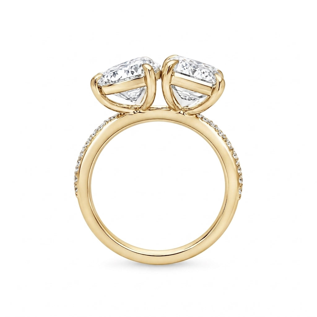 alt="profile view lab grown diamond toi et moi ring 14K yellow gold"