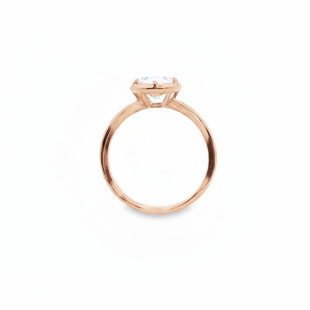 alt="profile view of lab grown oval cut diamond bezel set engagement ring in 14K rose gold"