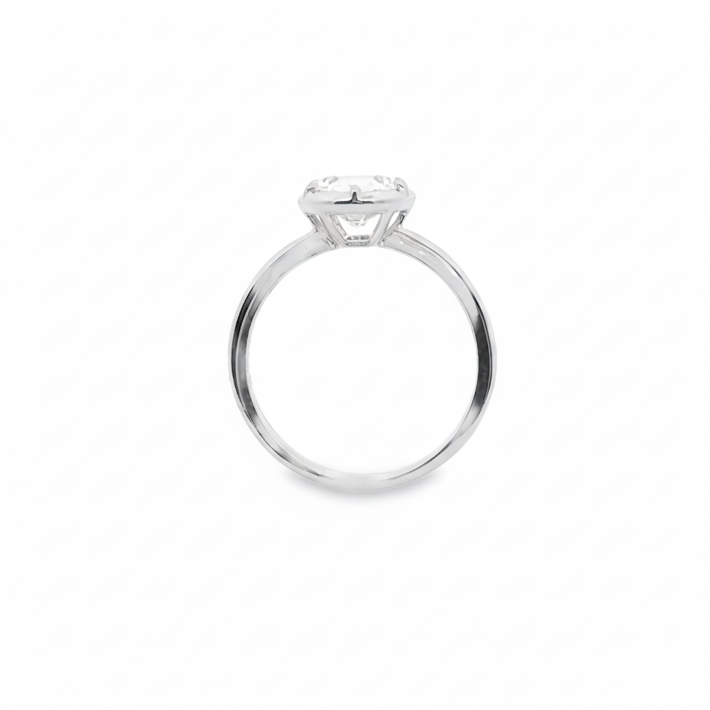 alt="profile view of lab grown oval cut diamond bezel set engagement ring in 14K white gold"