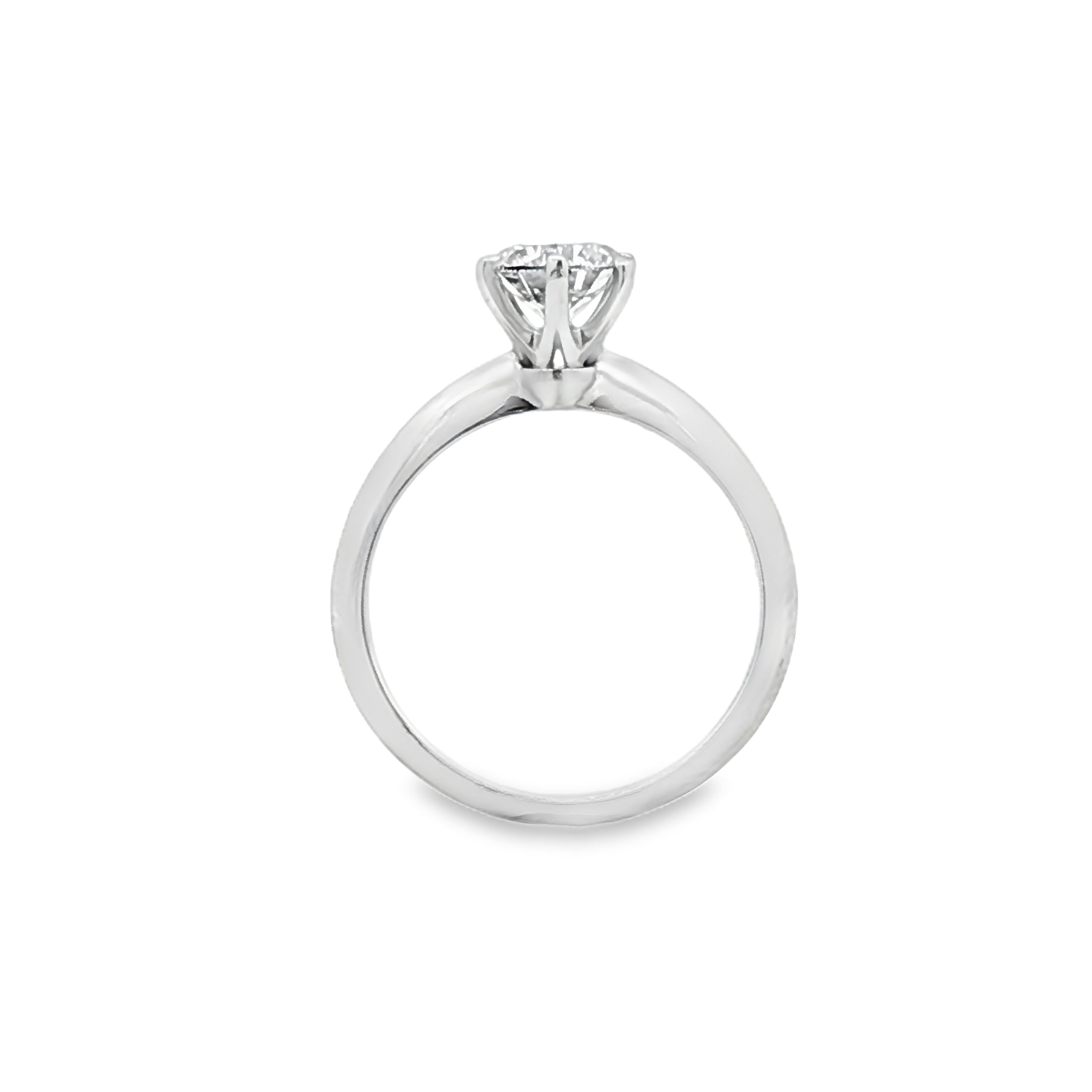 alt="profile view of lab grown round cut diamond six prong setting solitaire engagement ring in 14K white gold"