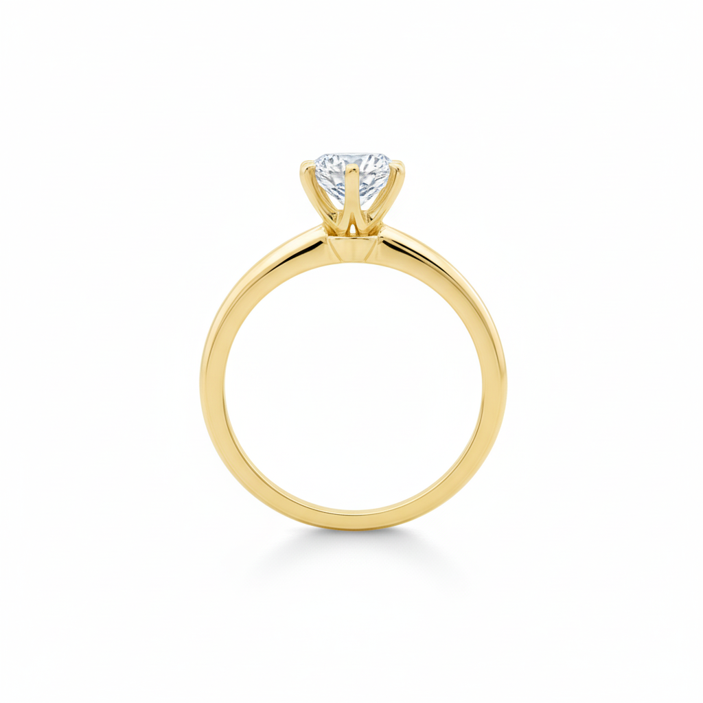 alt="profile view of lab grown round cut diamond six prong setting solitaire engagement ring in 14K yellow gold"