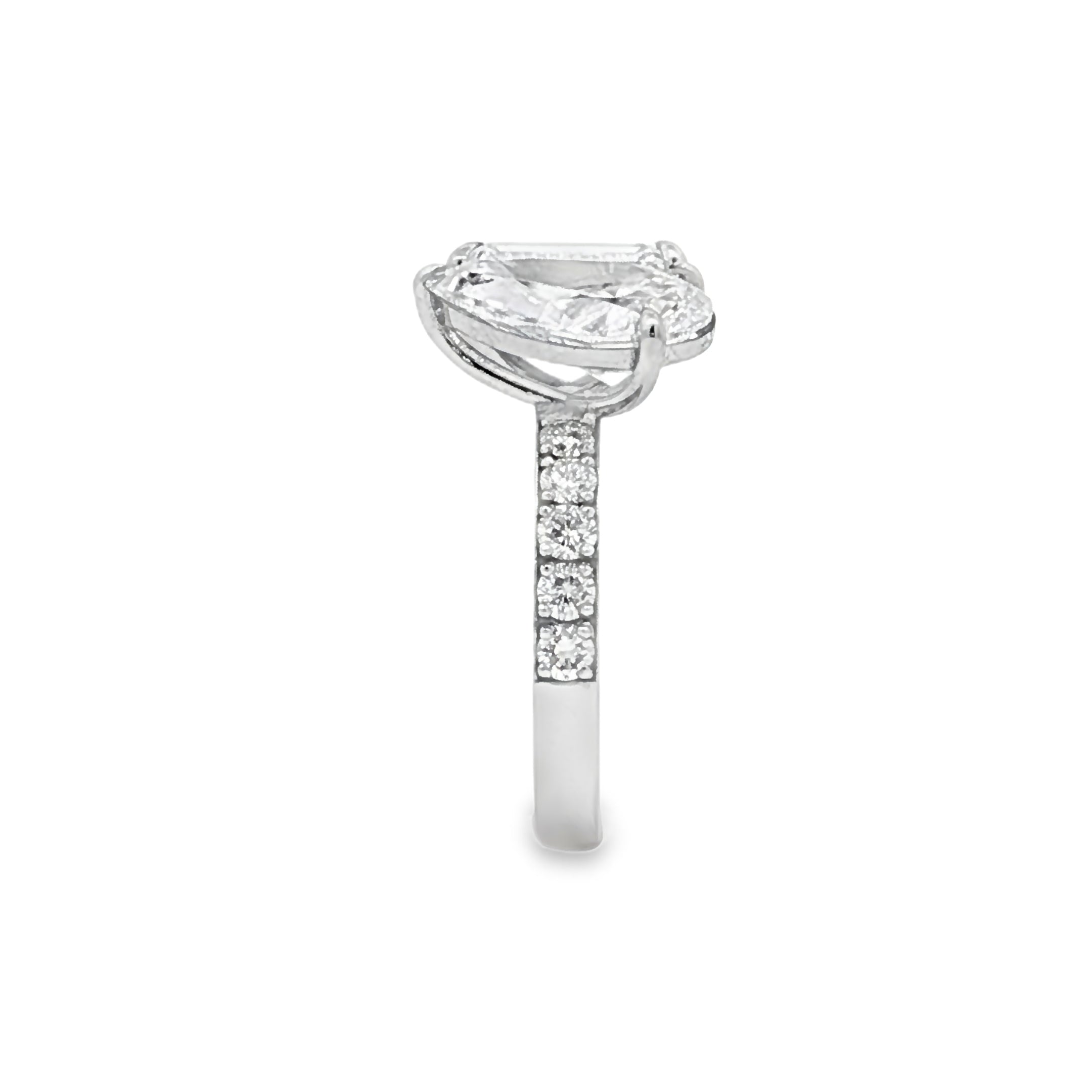 alt="side view of lab grown pear and emerald cut diamond toi et moi ring in 14K white gold"