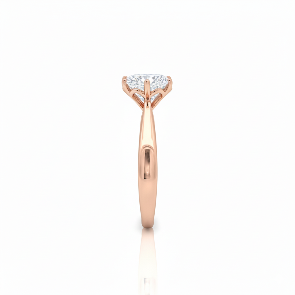 alt="side view of lab grown round cut diamond four prong setting solitaire engagement ring in 14K rose gold"