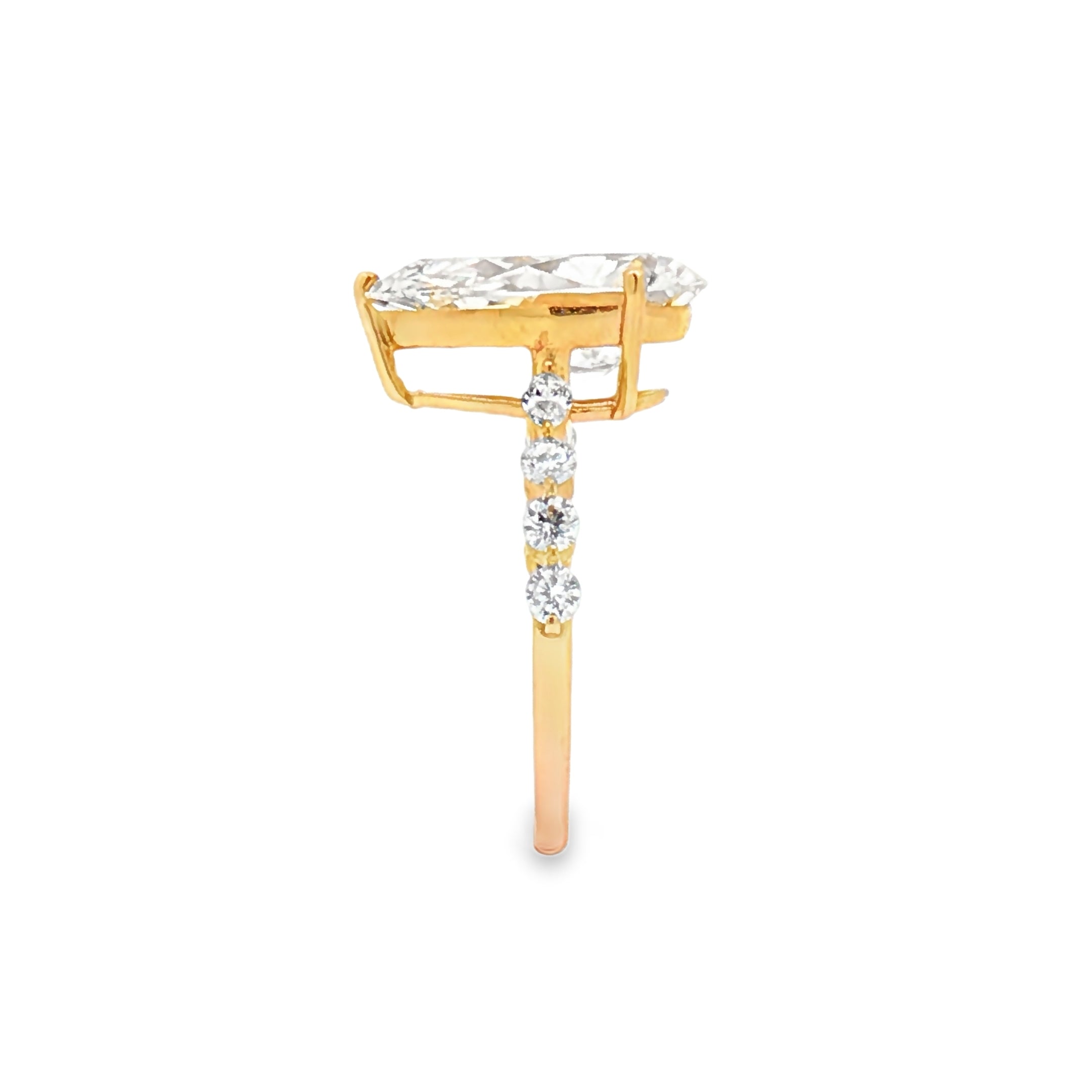 alt="side view of lab grown pear cut diamond engagement ring with accent band in 14K yellow gold"